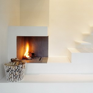 Minimalist Fireplace Beside the Floating Stairs