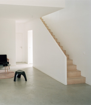 Wood staircase with white wall