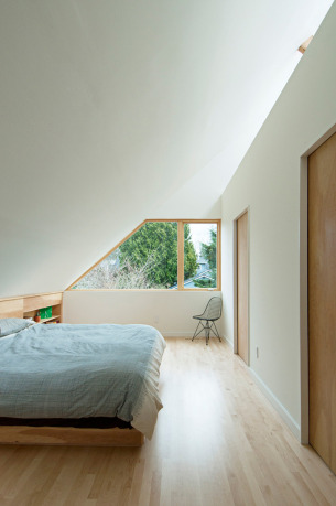 Bright bedroom with geometric window