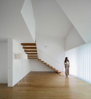 Sculptural interior with floating staircase