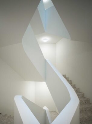 Meandering white staircase wall
